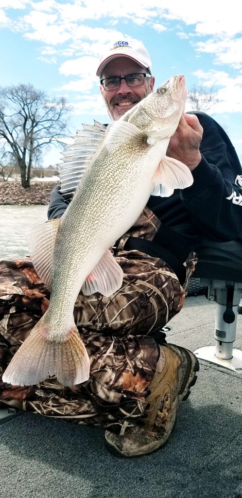 Steve Carney poses with a fish he caught in northern Minnesota